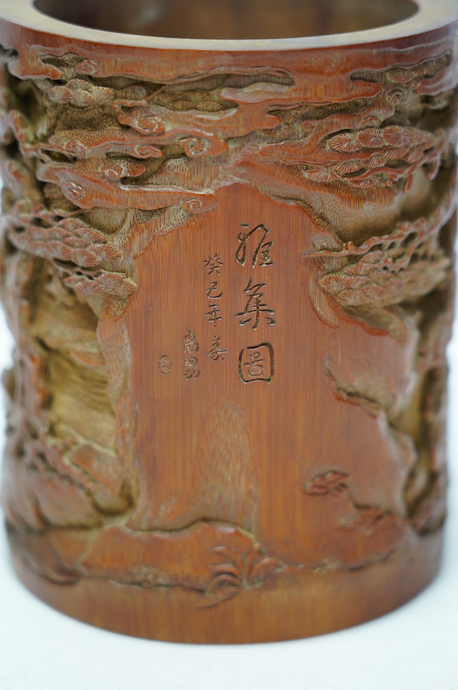 A Chinese carved bamboo 'scholars' brushpot, 15.5cm tall. Condition - fair to good